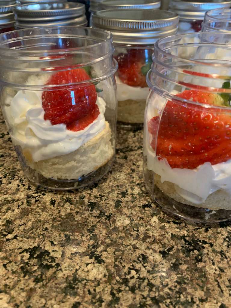 Mason-jar strawberry shortcakes plated by Crumbs & Crowns students